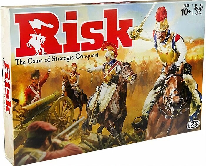 Risk board game box featuring strategic conquest artwork with soldiers on horseback and a cannon for strategy board games.