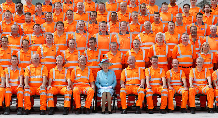 Queen Elizabeth Poses For A Group Photo With Construction Workers