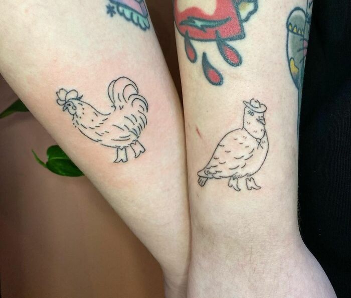 Matching rooster and pigeon tattoos