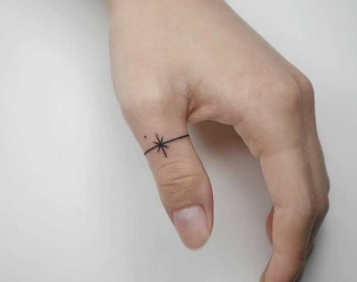 minimalistic tattoo of a finger ring