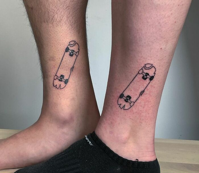 Matching skateboard leg tattoos