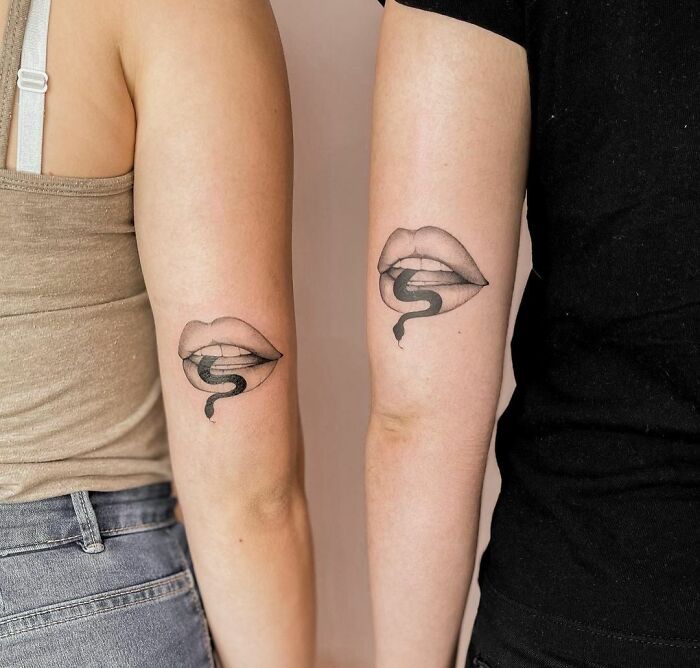 Matching lip arm tattoos
