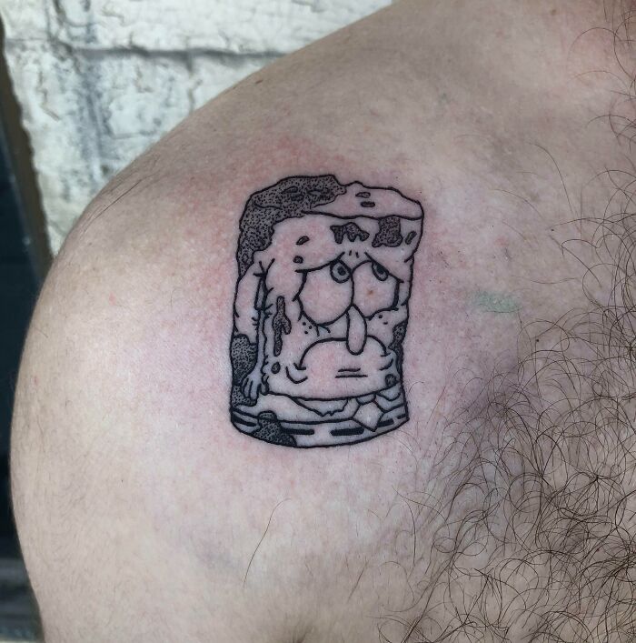 Sad SpongeBob SquarePants shoulder tattoo