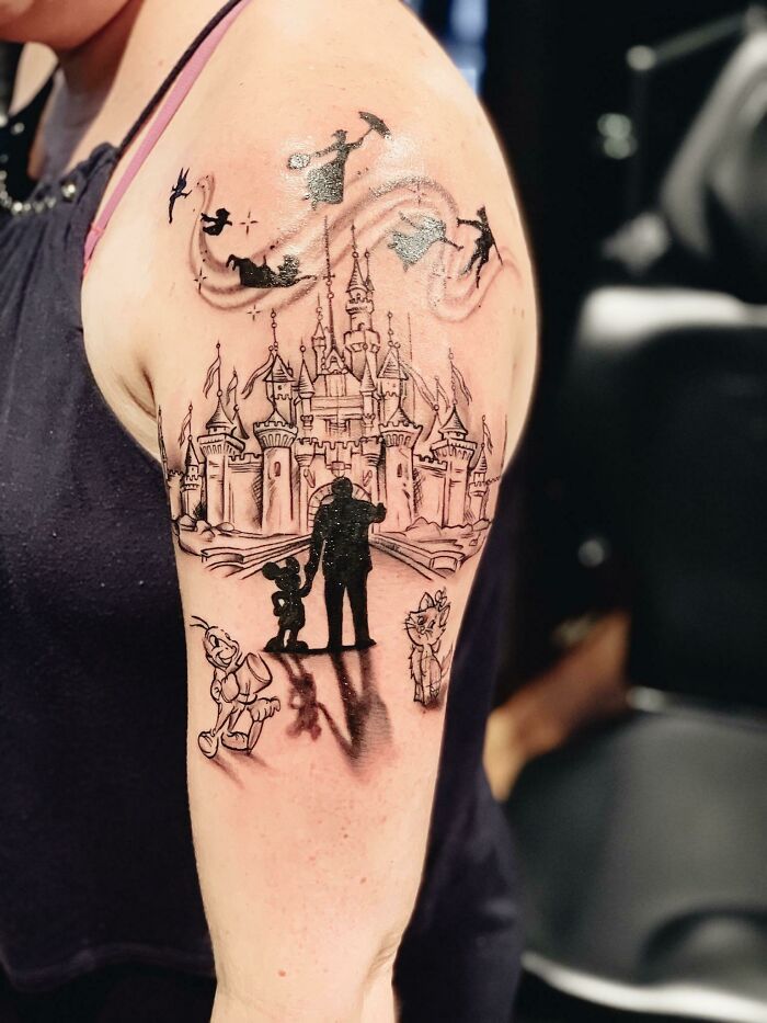 Walt Disney, And Mickey Mouse in front of a Castle with flying characters tattoo