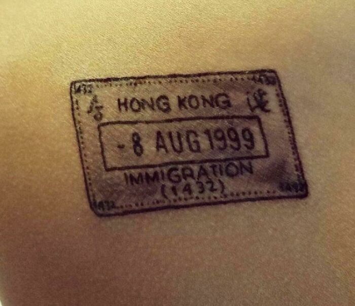 Tattoo of a Hong Kong immigration stamp with date 8 Aug 1999, symbolizing a significant memory on skin.
