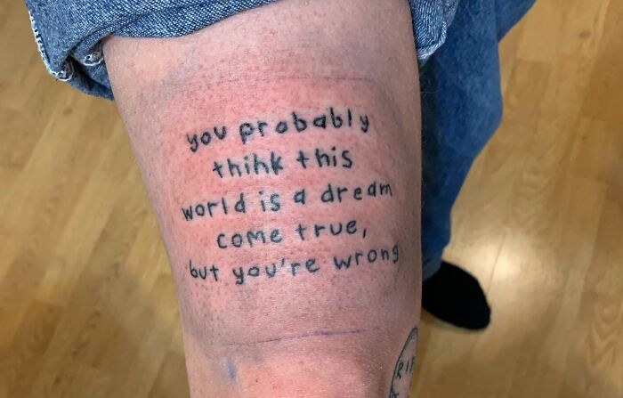 Coralline Quote Tattoo On The Lower Thigh