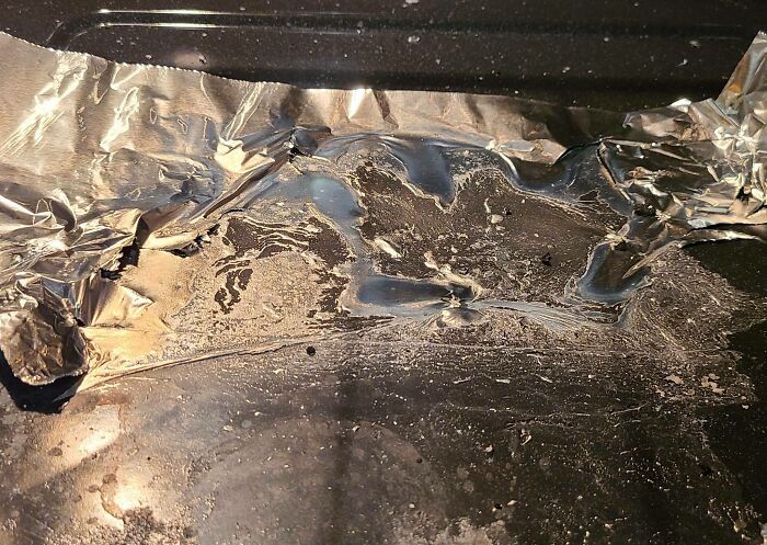 I Put Aluminum Foil Down In The Oven To Make Cleanup Easier After Cooking Pizza. The Foil Melted And Got Stuck Instead