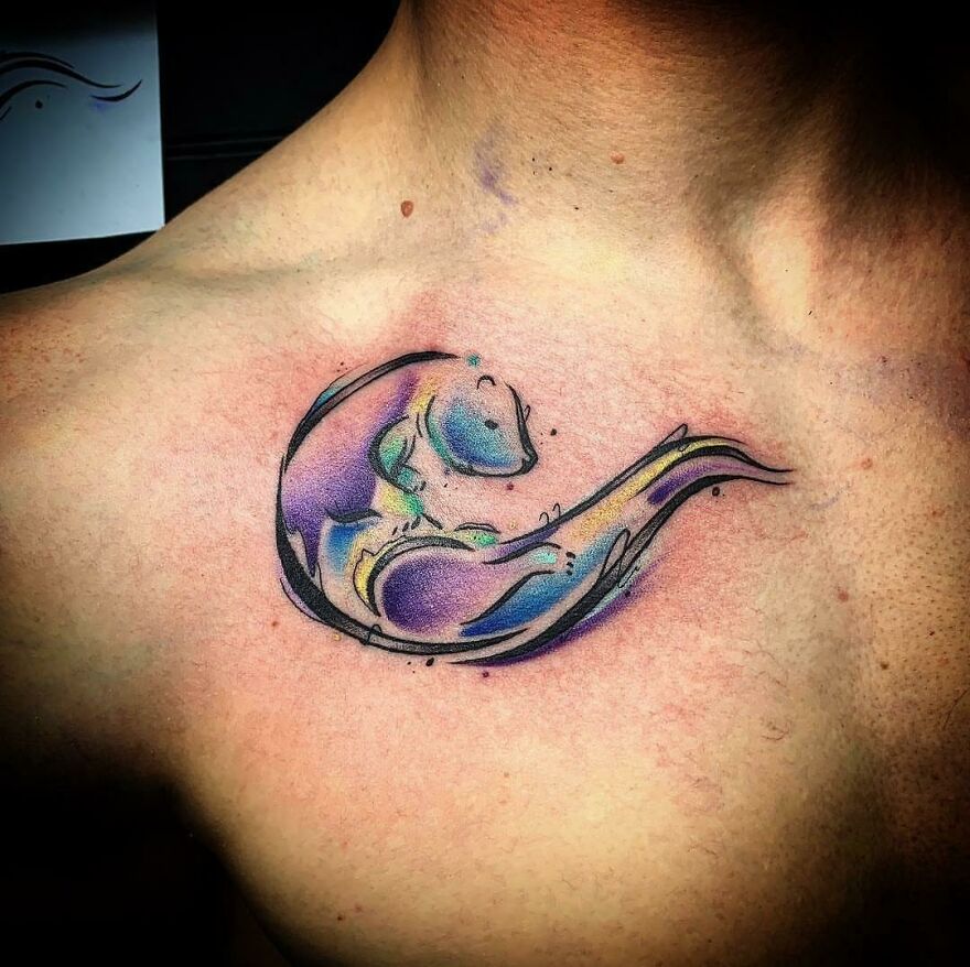watercolor otter tattoo on the chest