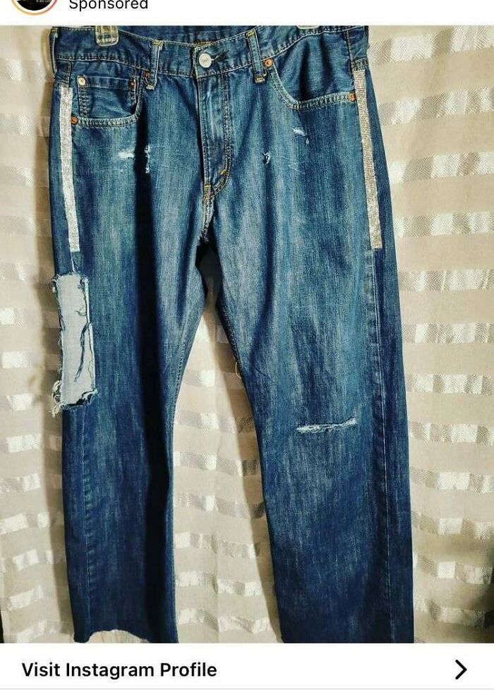 $100 For Old Levi’s With Some Fabric Cut Out And Rhinestones Stuck On, Photographed Hanging From A Stollen Hanger In Front Of A Shower Curtain