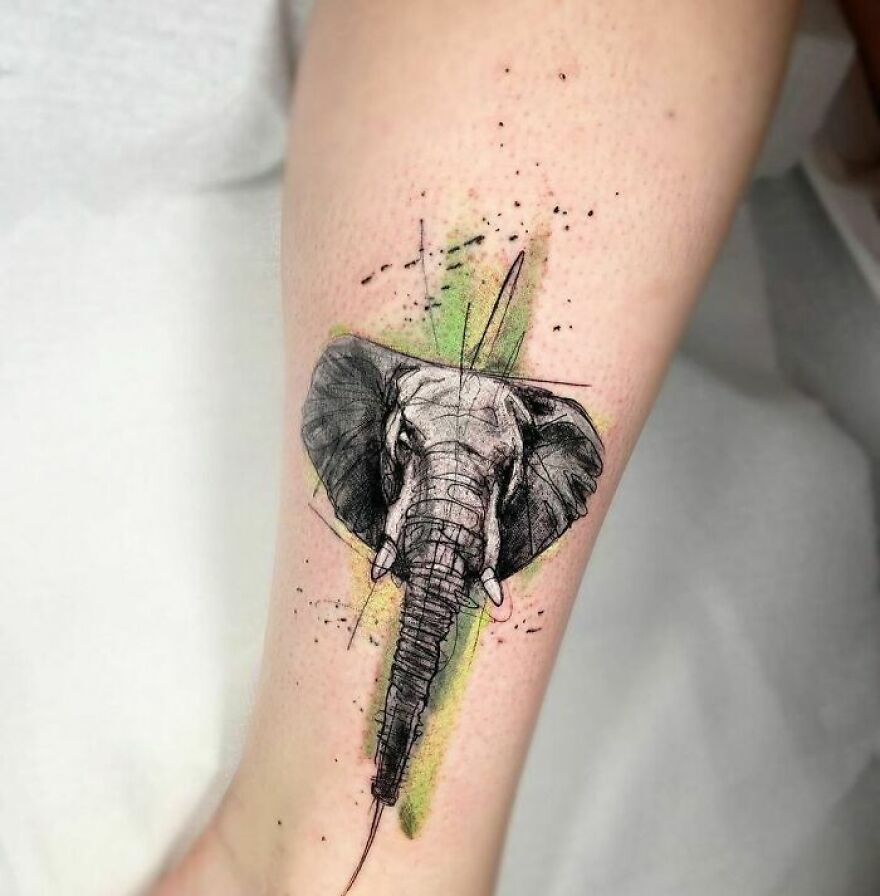 watercolor elephant tattoo on the leg