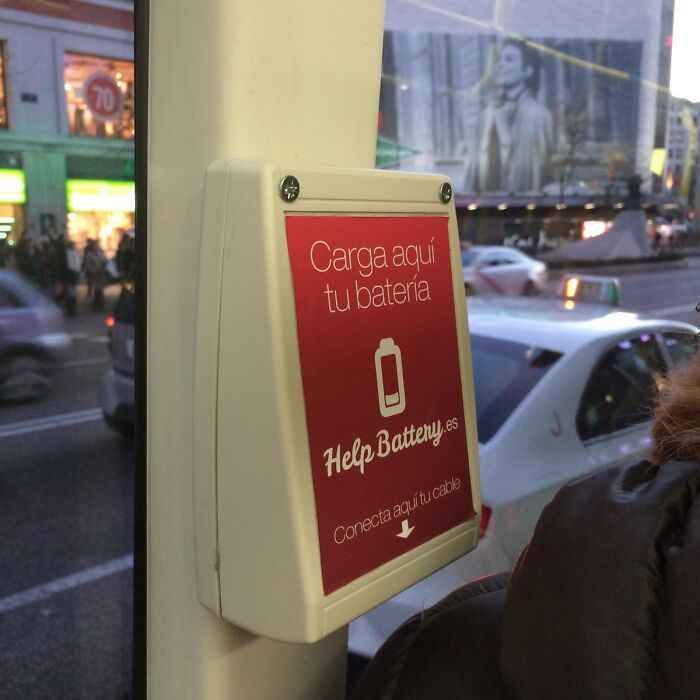 A Charging Station For Phones On A Bus In Madrid