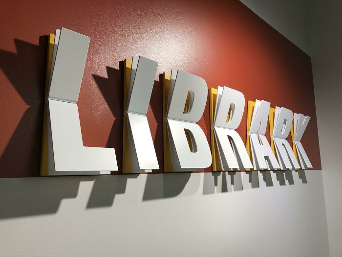 This Library Sign Is Metal Made To Look Like Open Books