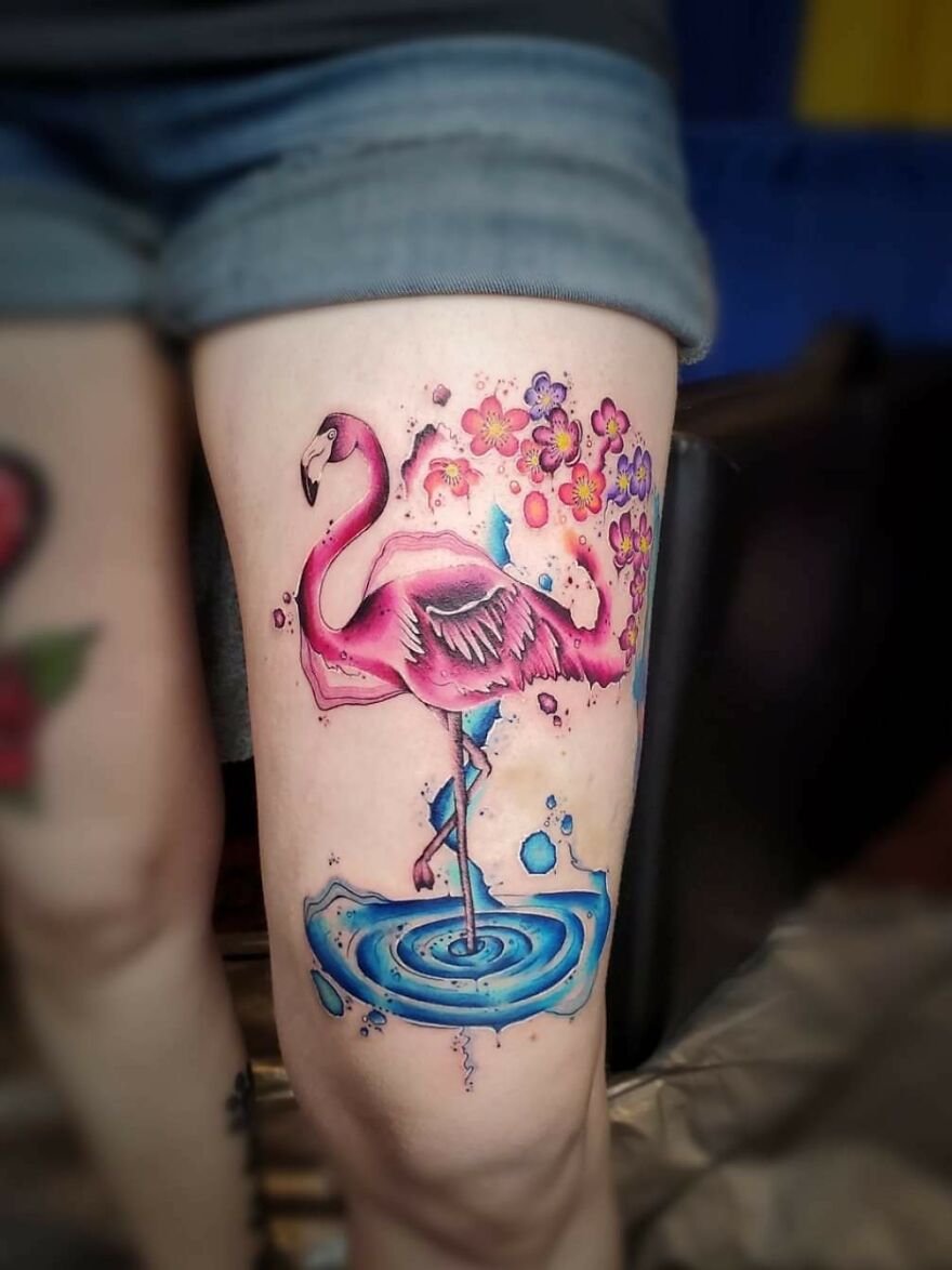 Watercolor flamingo with flowers tattoo on the leg