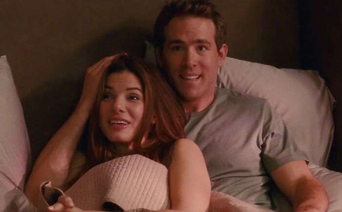Ryan Reynolds resting in bed with girlfriend and watching movie