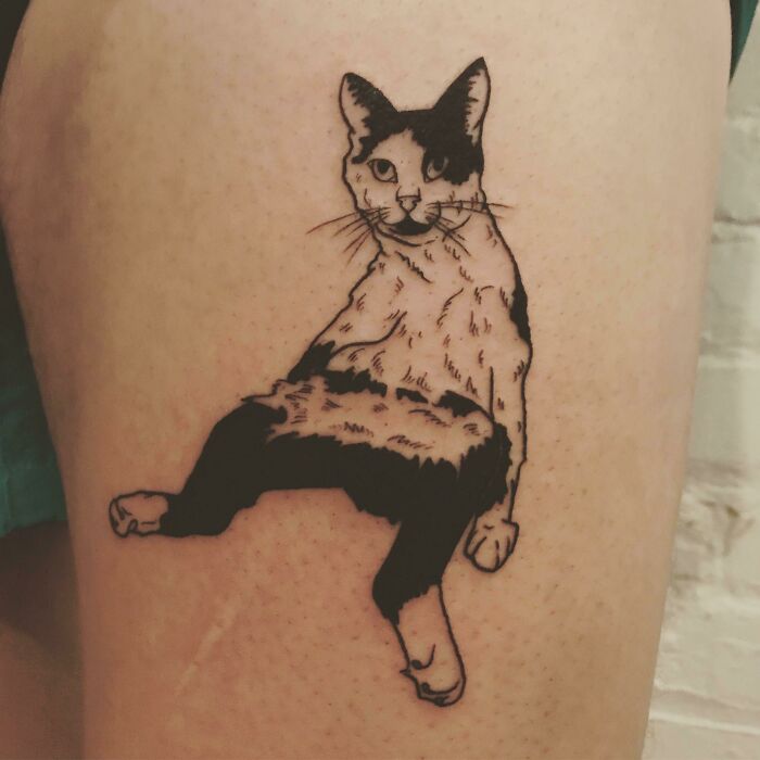 Cat sitting tattoo 