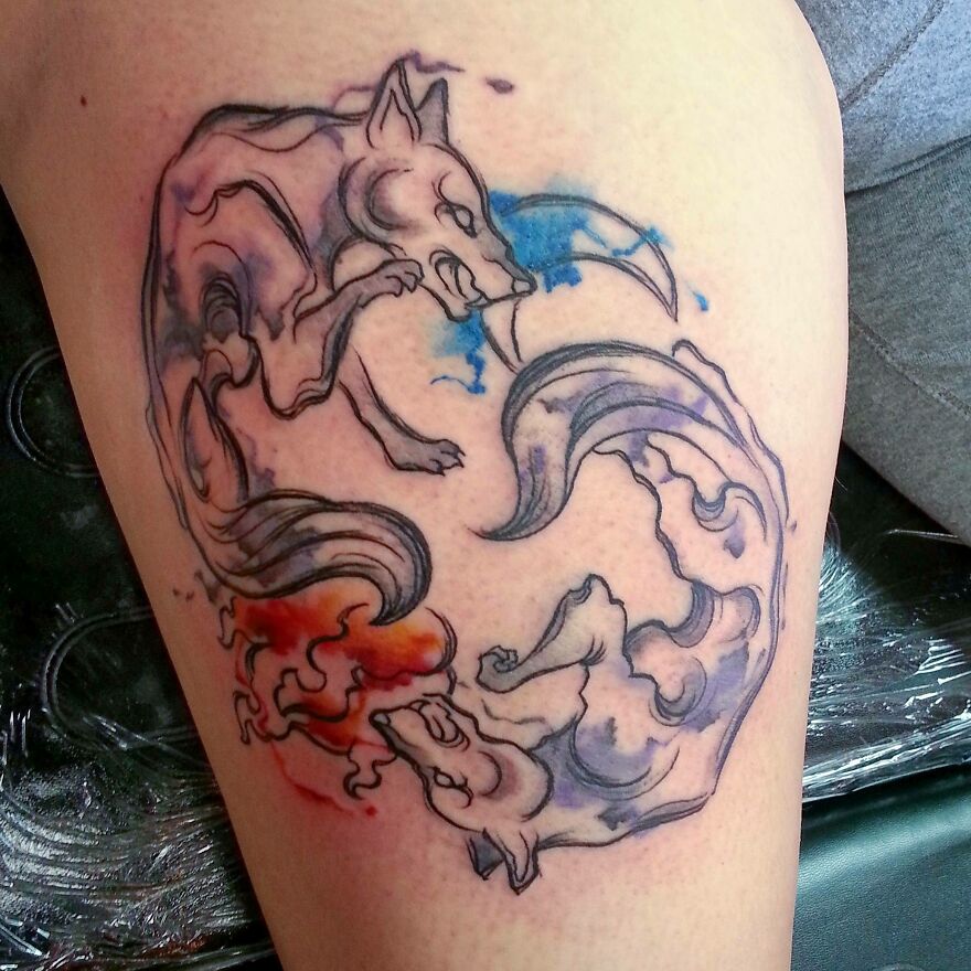 watercolor norse wolves tattoo on the leg