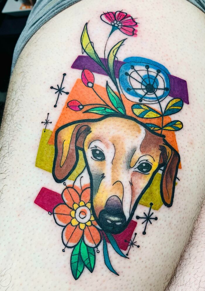 Dog, flowers and geometrical shapes tattoo
