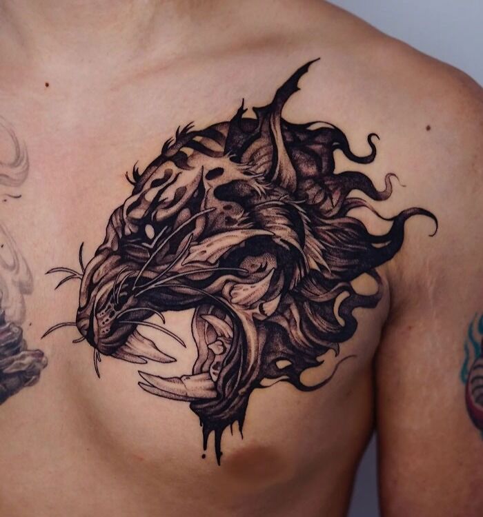 Detailed animal tattoo on chest, showcasing simplicity and realism.