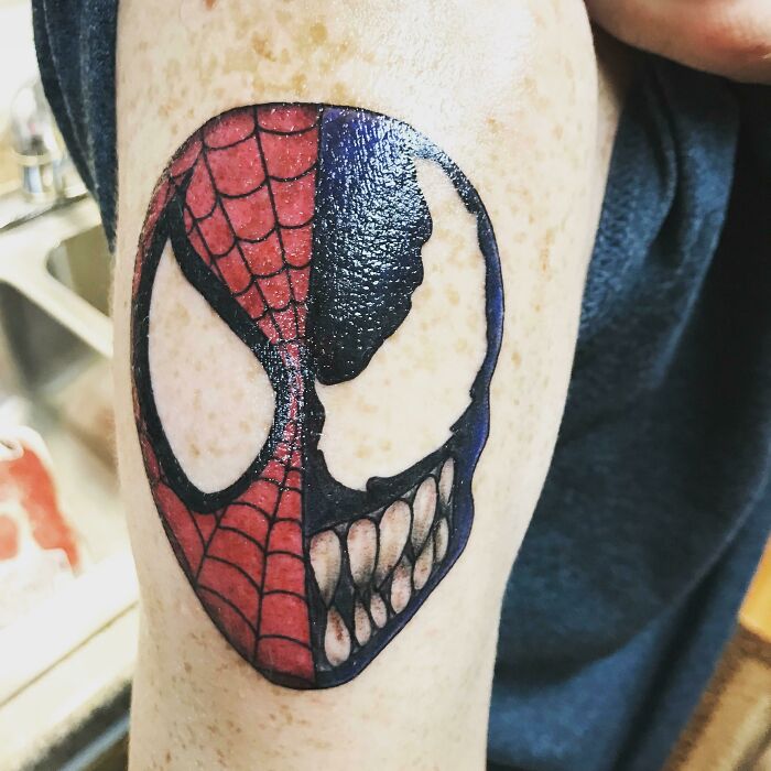 Half Spiderman's face and Venom's tattoo 