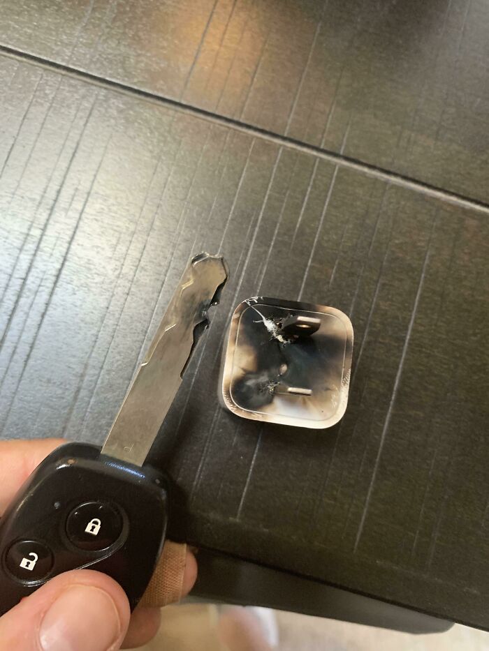 Car Key Fell Off Night Stand And Onto A Half Plugged In iPhone Charging Brick
