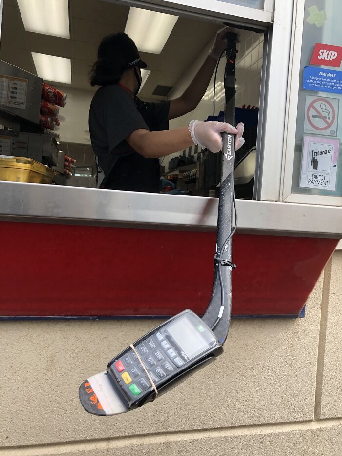This Is A Dairy Queen Drive-Through In Canada Where They Social Distance By Using A Debit Machine Zip Tied To A Hockey Stick. You Can’t Make This Up