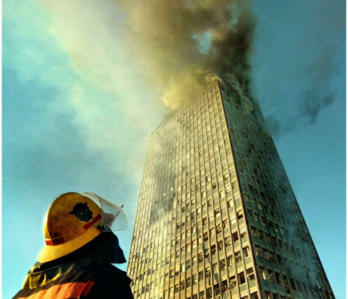 A Firefighter Looks Towards The Heavily Damaged Belgrade's Tallest Building, Nato Bombing, April 1999 