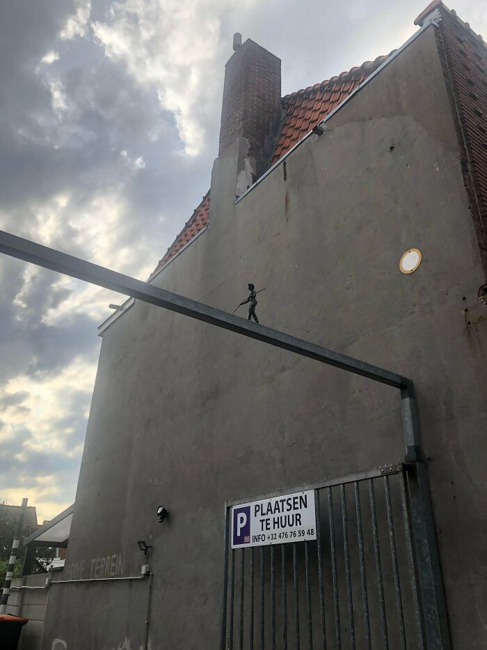 Lil Balancing Dude Above A Gate In Tilburg, The Netherlands