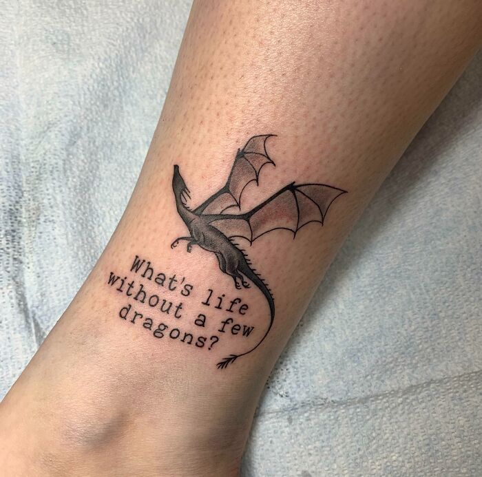 Dragon tattoo with quote on leg, inspired by Harry Potter.