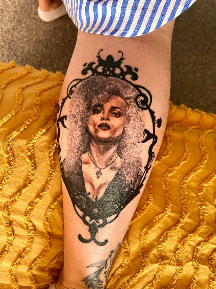 Harry Potter tattoo depicting a detailed portrait of a character within an ornate frame on a person's calf.