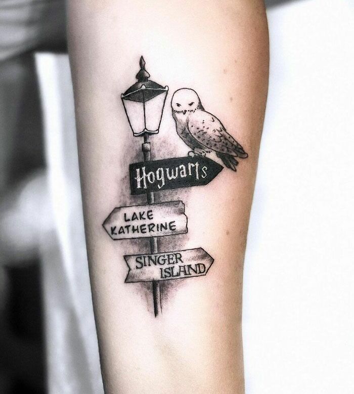 Harry Potter tattoo featuring an owl on a directional signpost pointing to Hogwarts, Lake Katherine, and Singer Island.