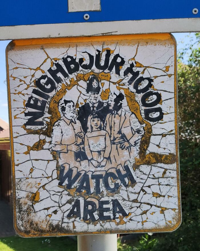 This Weathered Neighborhood Watch Sign