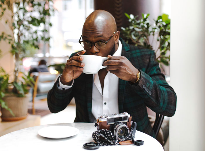 Man drinking tea and sitting