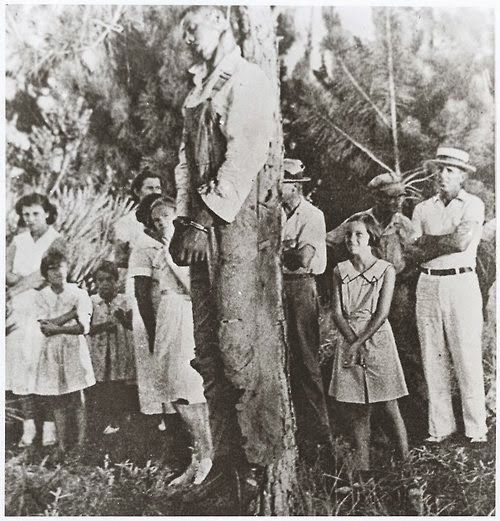 A-crowd-gazes-at-the-body-of-Rubin-Stacy-a-black-tenant-farmer-lynched-in-July-1935-at-Fort-Lauderdale-Stacy-was-originally-arrested-for-frightening-a-white-woman-named-Marion-Jones-at-her-home-Jon-631728668c995.jpg