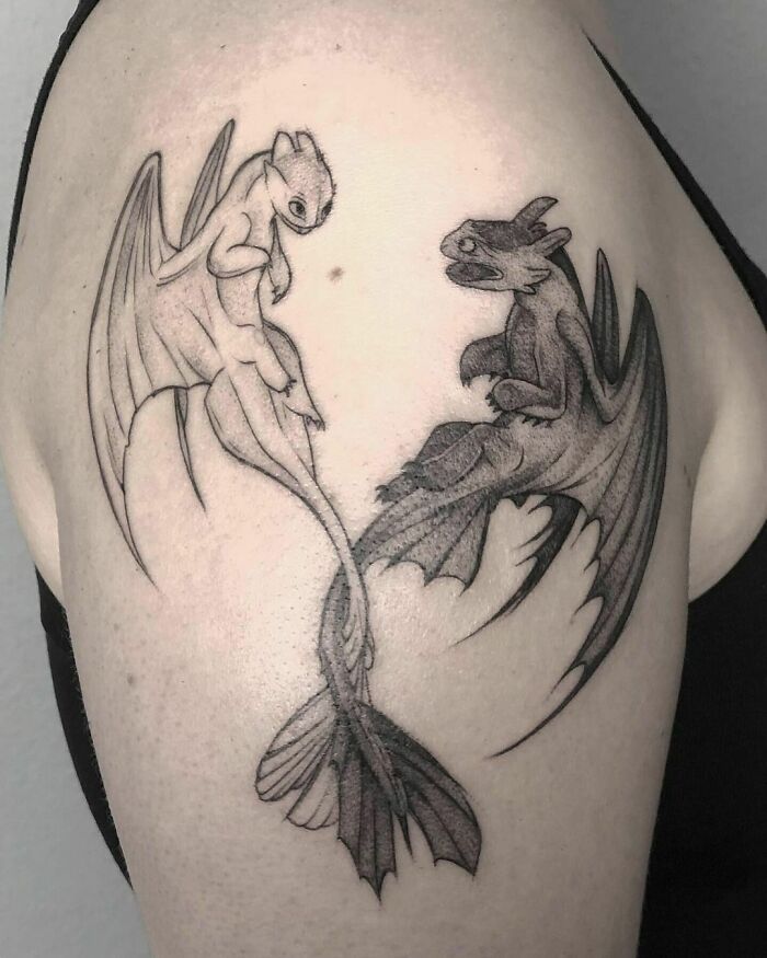 Toothless and Light Fury from How To Train Your Dragon shoulder tattoo