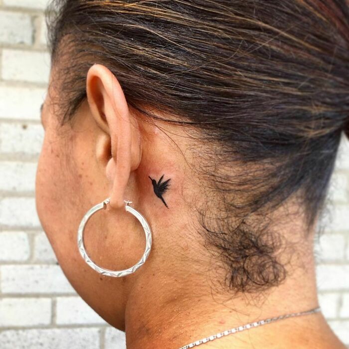 ear tattoo of a bird