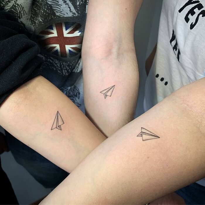 minimalistic tattoo of paper planes
