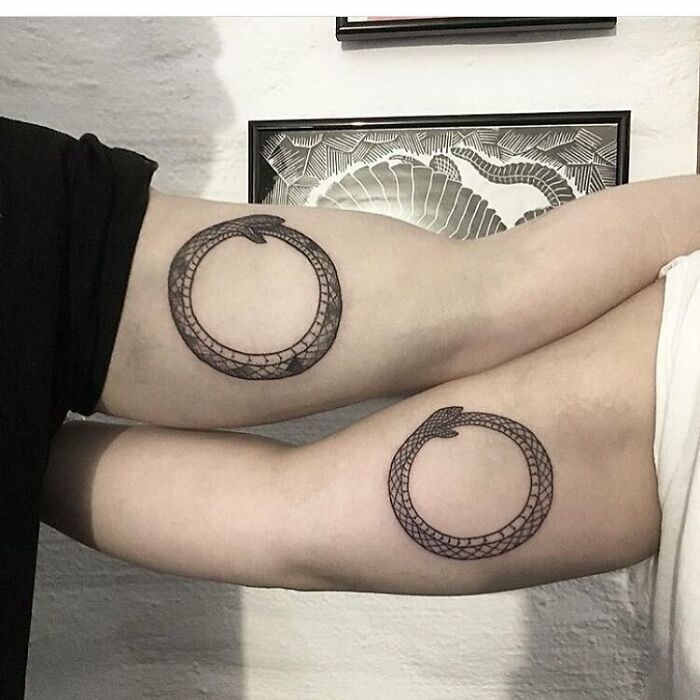 Ouroboros matching tricep tattoos