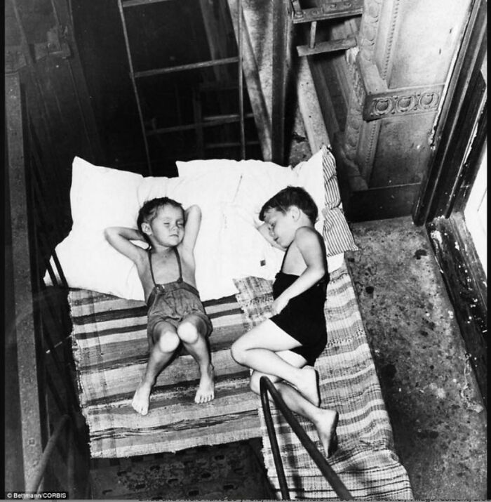 New York Children Sleeping On The Fire Escape To Keep Cool At Night. Early 1900 ‘S