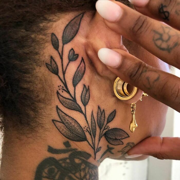 ear tattoo of a stem with a lot of leaves