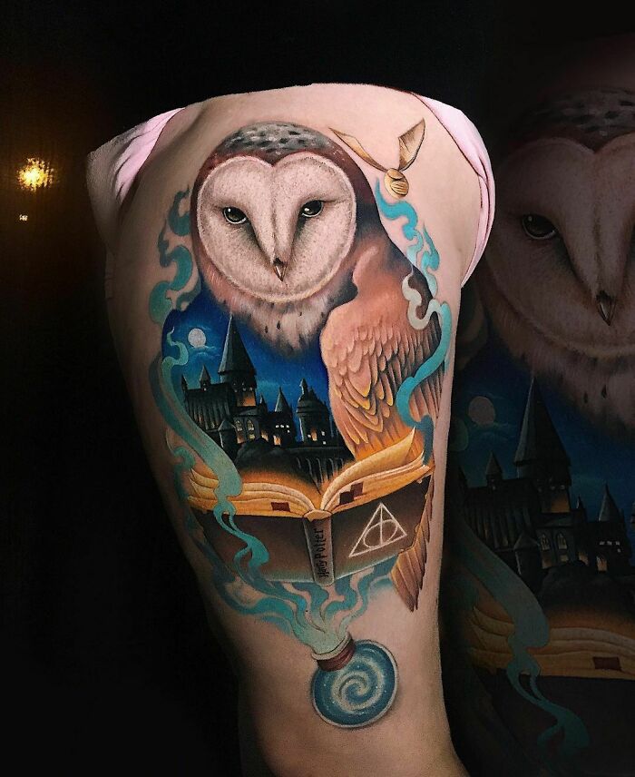 Harry Potter tattoo featuring an owl, Hogwarts, and magical elements on a person's arm.