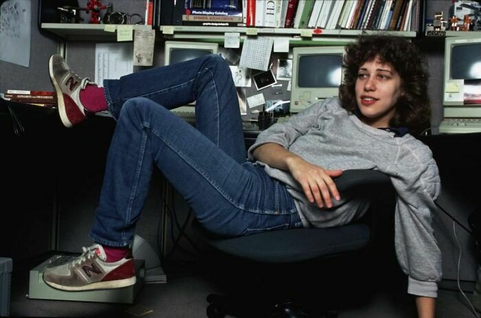 Susan Kare laying in an office chair 