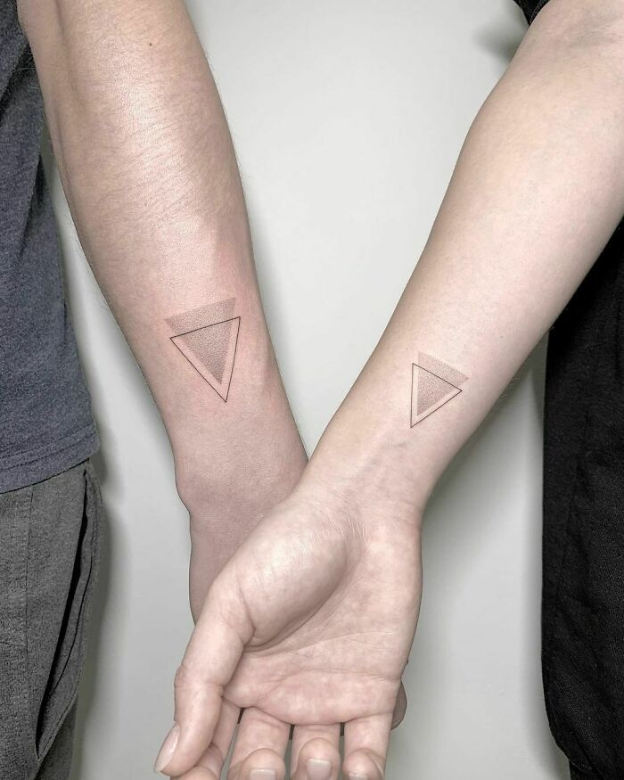 Triangle matching wrist tattoos