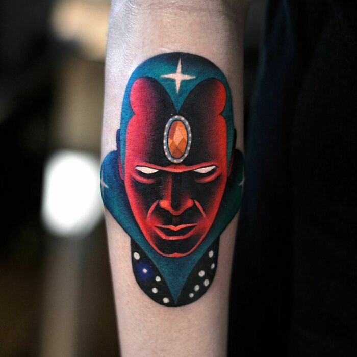 Vibrant Marvel tattoo featuring a superhero design on a forearm.