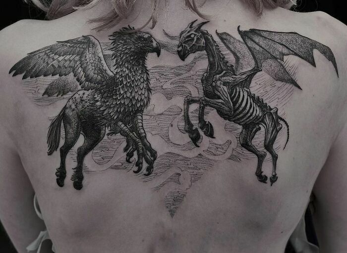 Wizarding World tattoo featuring a Hippogriff and Thestral on a person's back.