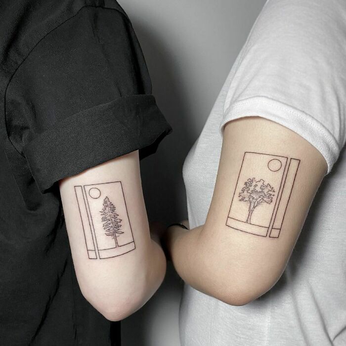 Matching pictures of trees arm tattoos