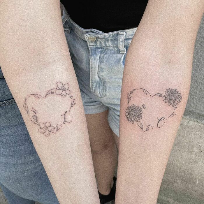 Heart made of flowers matching forearm tattoos