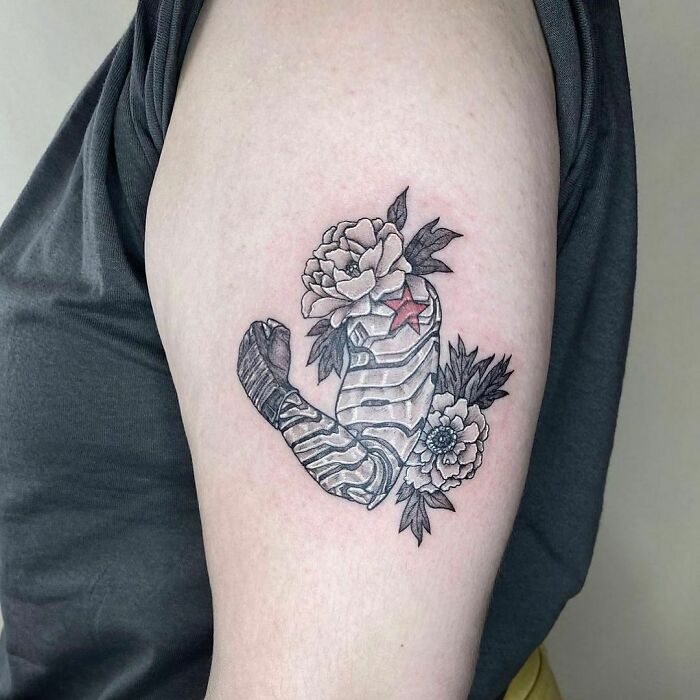 Buckys' arm with flowers tattoo