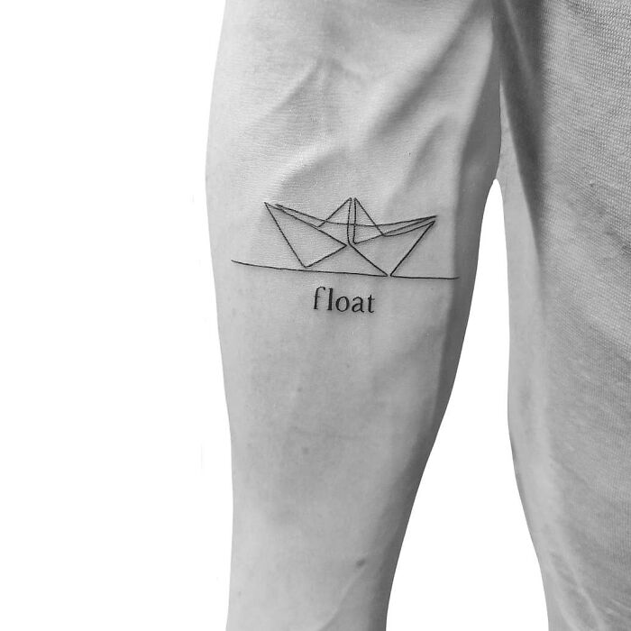 Single line origami boat arm tattoo