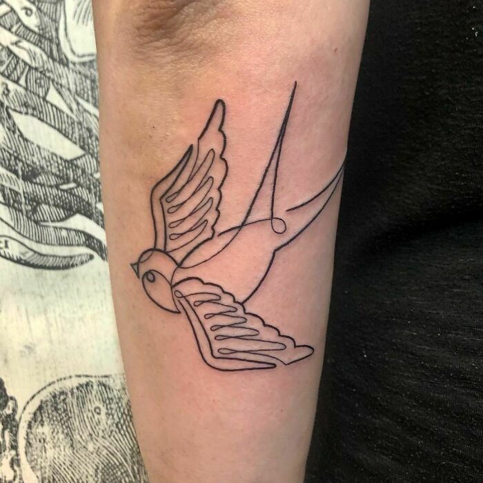 Single line bird arm tattoo