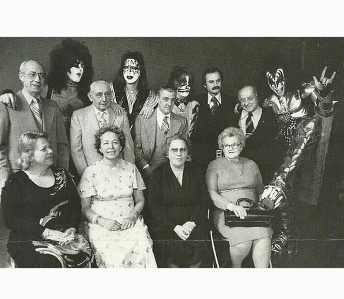 Rock band KISS and their parents posing for a picture 